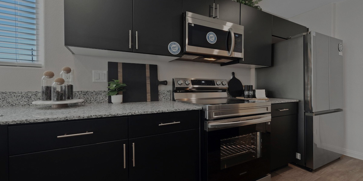 A new kitchen with stainless steel appliances and modern finishes